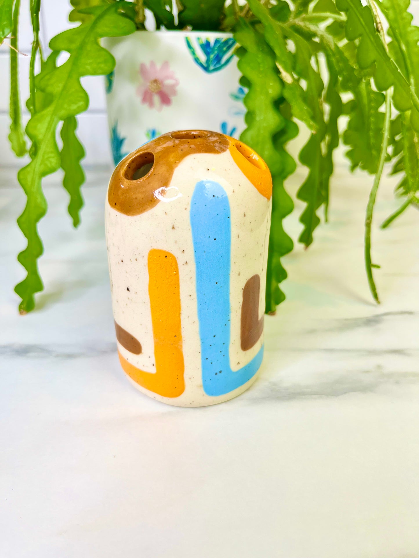 Orange, Blue, and Brown Lined Bud Vase